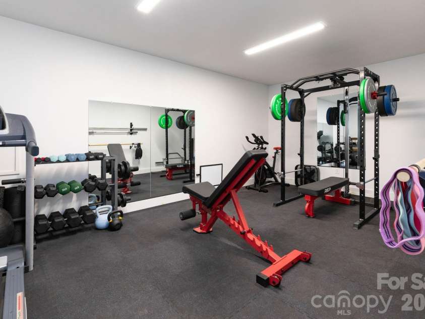 32 Greenwood Fields Drive, Asheville, NC 28804.  MLS# CAR4389638, YatesRealty ID 32475. Basement Gym
