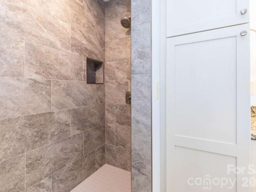 32 Greenwood Fields Drive, Asheville, NC 28804.  MLS# CAR4389638, YatesRealty ID 32475. Primary Bathroom Tiled Shower
