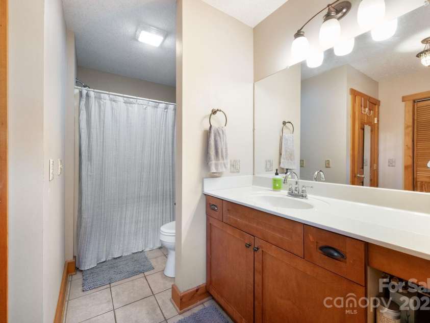 1 Buckingham Court, Asheville, NC 28803.  MLS# CAR4283545, YatesRealty ID 32483. Full bath with shower and tub