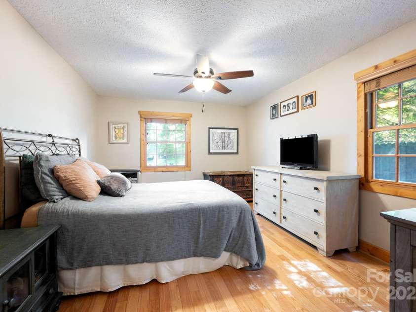 1 Buckingham Court, Asheville, NC 28803.  MLS# CAR4283545, YatesRealty ID 32483. Hardwoods extend to primary bedroom