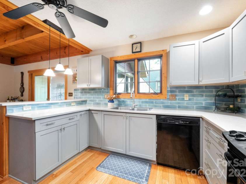 1 Buckingham Court, Asheville, NC 28803.  MLS# CAR4283545, YatesRealty ID 32483. New counters and tile surround