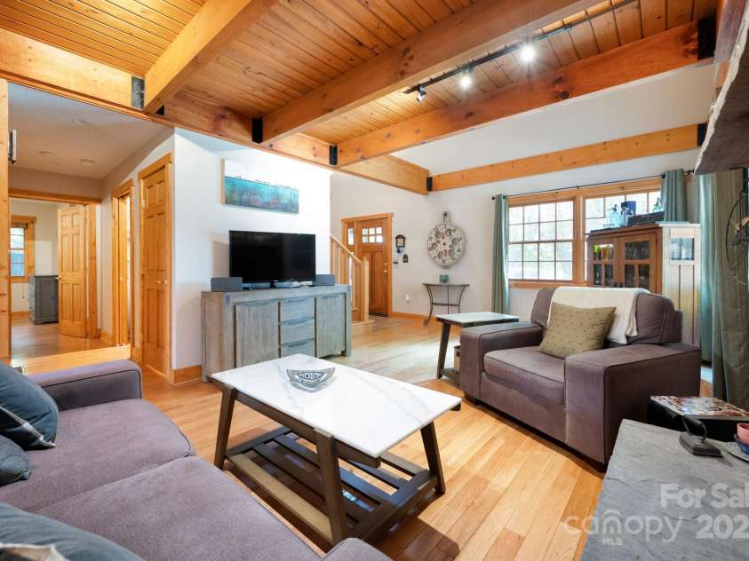 1 Buckingham Court, Asheville, NC 28803.  MLS# CAR4283545, YatesRealty ID 32483. Primary bedroom, half bath, and laundry off living area