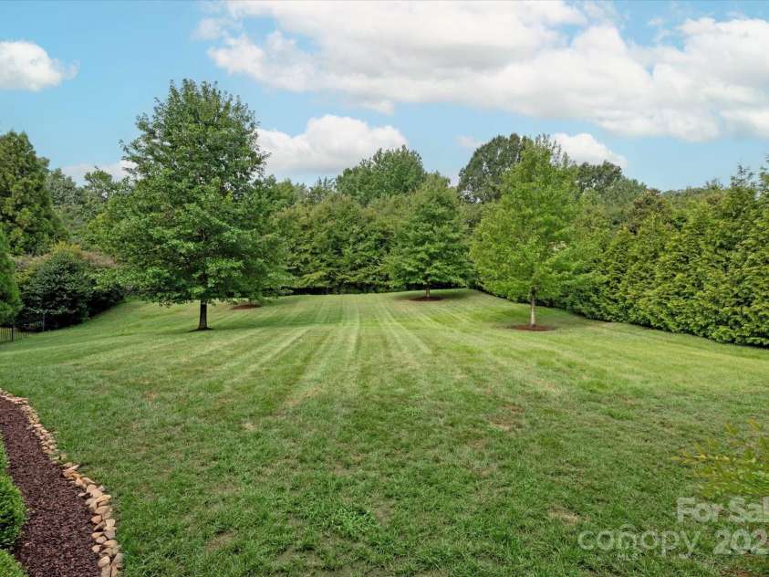 4042 Blossom Hill Drive, Matthews, NC 28104.  MLS# CAR4288024, YatesRealty ID 32490. Backyard