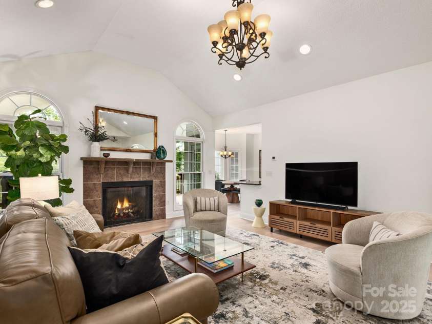 446 Charming Lane, Hendersonville, NC 28792.  MLS# CAR4287765, YatesRealty ID 32506. Enjoy gathering around the fireplace in the grand living room featuring vaulted ceilings and recessed lighting