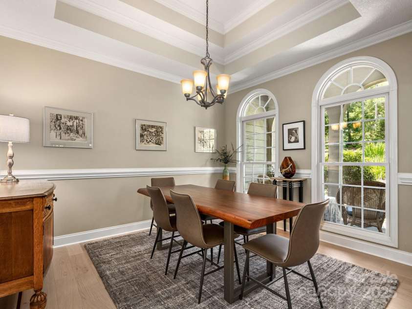 446 Charming Lane, Hendersonville, NC 28792.  MLS# CAR4287765, YatesRealty ID 32506. Formal dining room offers additional space to gather around the table, tall windows and tray ceiling accentuate the space