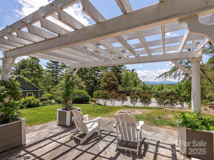 446 Charming Lane, Hendersonville, NC 28792.  MLS# CAR4287765, YatesRealty ID 32506. Idyllic pergola to sit and take in the views
