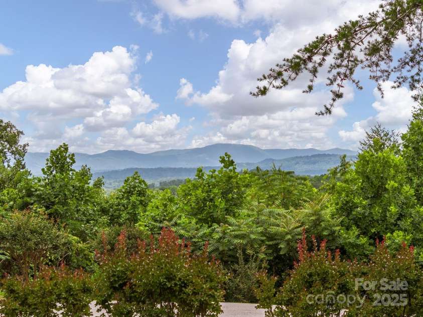 446 Charming Lane, Hendersonville, NC 28792.  MLS# CAR4287765, YatesRealty ID 32506. Soak in picture-perfect Blue Ridge Mountain views from the Pergola