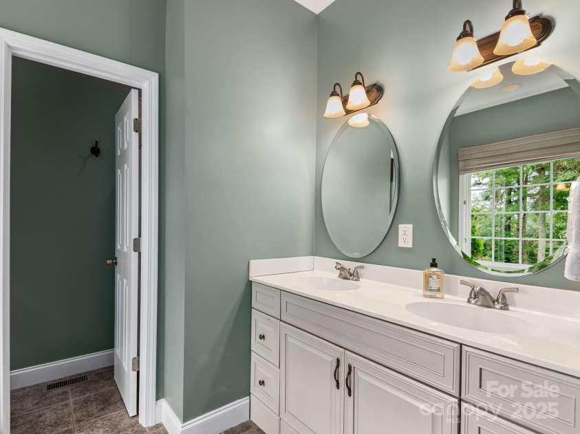 446 Charming Lane, Hendersonville, NC 28792.  MLS# CAR4287765, YatesRealty ID 32506. Spa-like primary bathroom