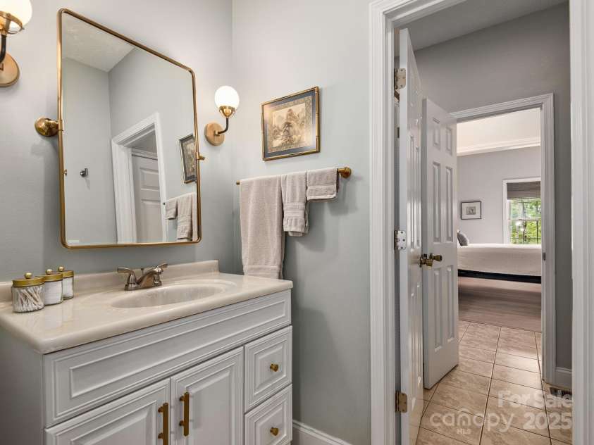 446 Charming Lane, Hendersonville, NC 28792.  MLS# CAR4287765, YatesRealty ID 32506. Tastefully designed bathroom convenient for guest bedrooms