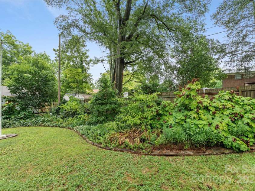 1740 Lansdale Drive, Charlotte, NC 28205.  MLS# CAR4263838, YatesRealty ID 32517. Flagpole in back yard
