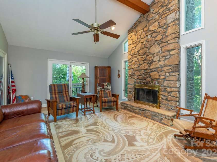 10 Chestnut Ridge Road, Mills River, NC 28759.  MLS# CAR4285429, YatesRealty ID 32518. Family room with stunning rock fireplace.