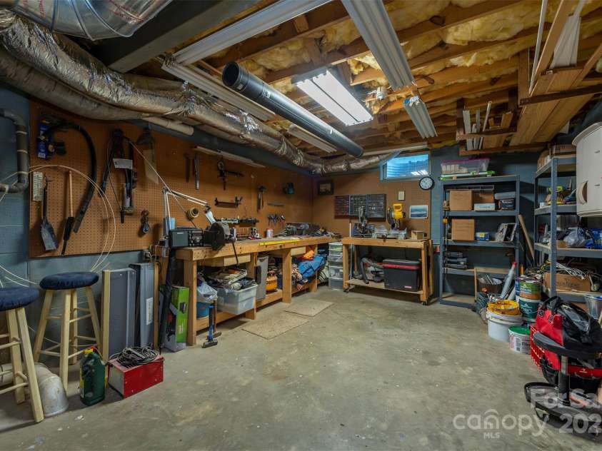10 Chestnut Ridge Road, Mills River, NC 28759.  MLS# CAR4285429, YatesRealty ID 32518. Workshop! with extra storage and easy access to hot water heater and HVAC