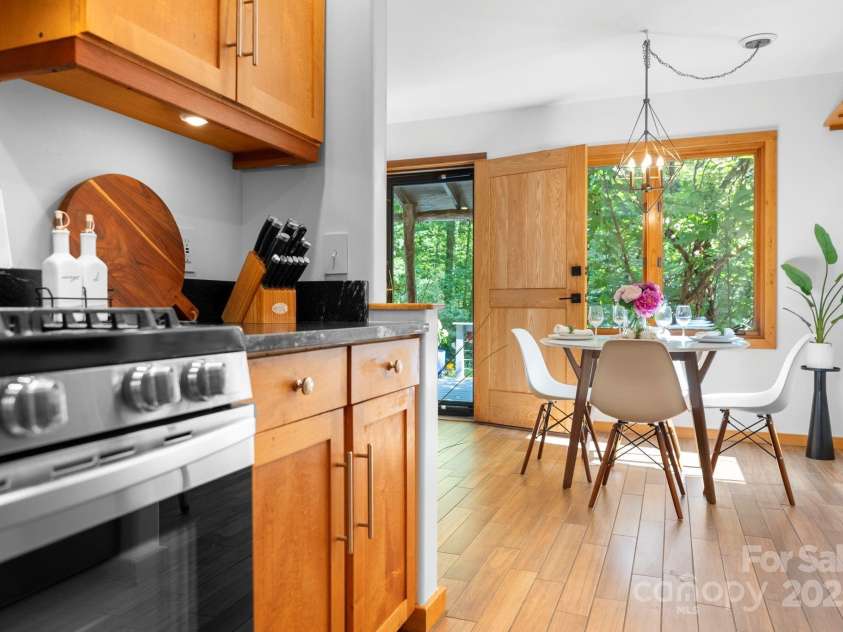 48 Black Oak Forest Road, Fairview, NC 28730.  MLS# CAR4275756, YatesRealty ID 32522. Kitchen Opens to Dining Area 