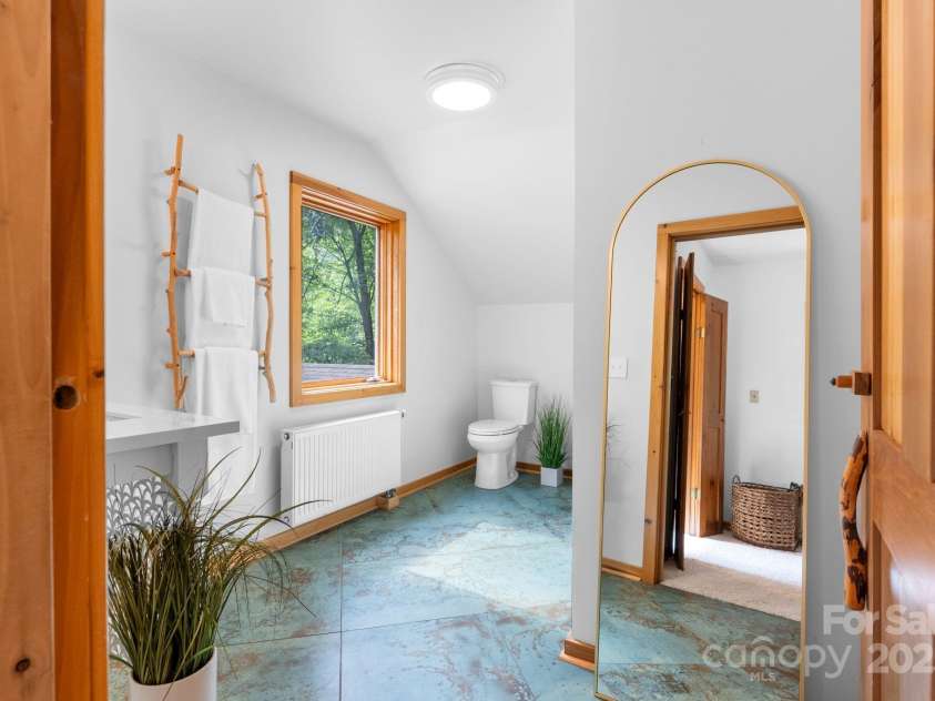 48 Black Oak Forest Road, Fairview, NC 28730.  MLS# CAR4275756, YatesRealty ID 32522. Remodeled Primary Bath w/ built-ins & picture window