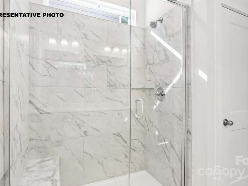 2069 Skyhawk Drive, York, SC 29745.  MLS# CAR4289638, YatesRealty ID 32539. Large walk-in tiled shower
