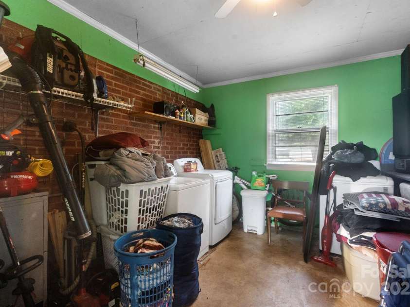 1106 3rd Street Drive, Conover, NC 28613.  MLS# CAR4290765, YatesRealty ID 32557. Laundry in carport area