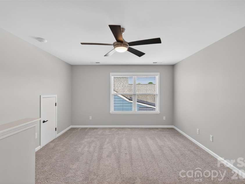3008 Bartlett Street, Fort Mill, SC 29715.  MLS# CAR4388924, YatesRealty ID 32557. Loft will full bath, attached third bedroom, wailk-in closet, and storage room may function as private suite for guests or care takers.