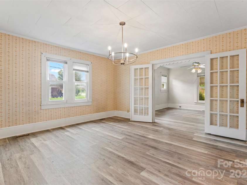 2407 Main Street, Kannapolis, NC 28081.  MLS# CAR4288336, YatesRealty ID 32559. Dining with french doors leading to living room