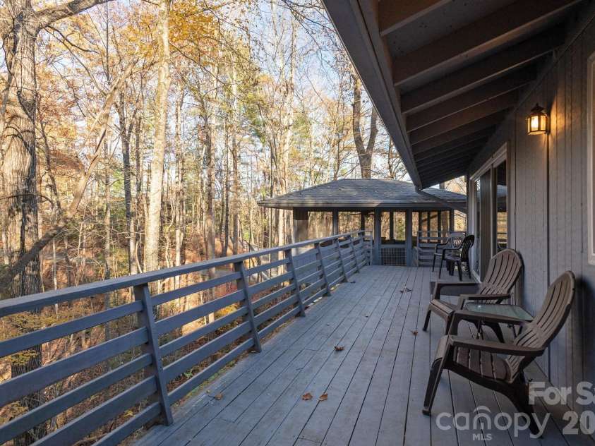 250 Butternut Lane, Brevard, NC 28712.  MLS# CAR4316894, YatesRealty ID 3256. Back Deck in the Trees