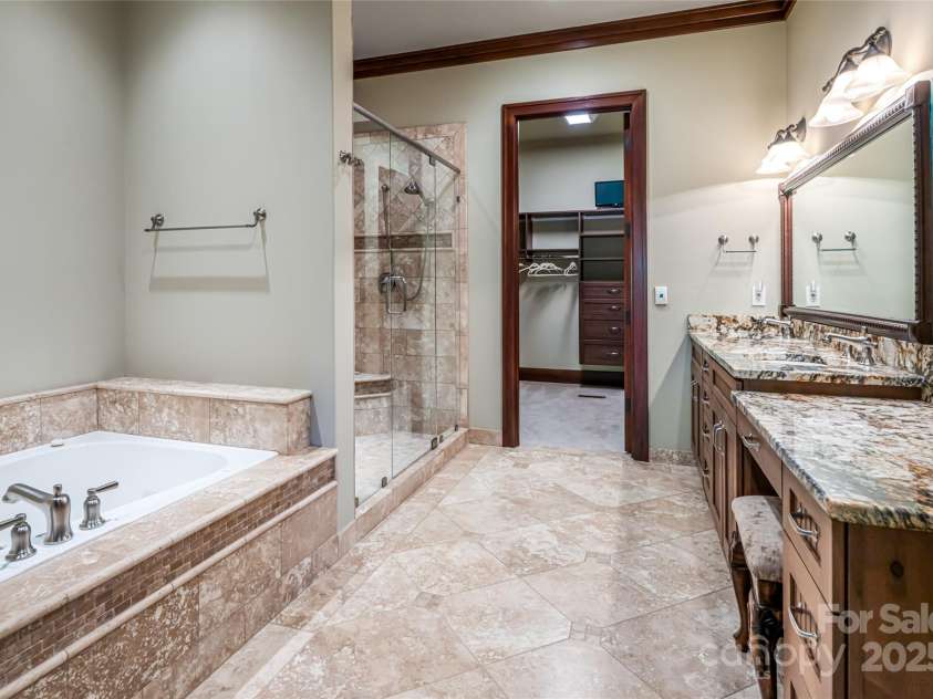 97 Lombard Street, Waynesville, NC 28786.  MLS# CAR4282341, YatesRealty ID 32568. Full bath #3 off second primary bedroom suite at terrace level