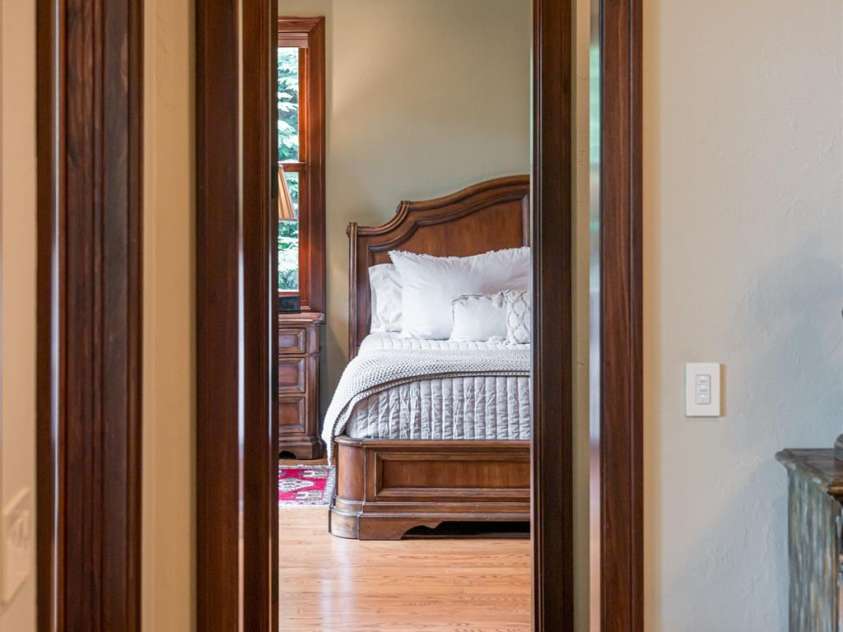 97 Lombard Street, Waynesville, NC 28786.  MLS# CAR4282341, YatesRealty ID 32568. Gazing in the main level primary suite