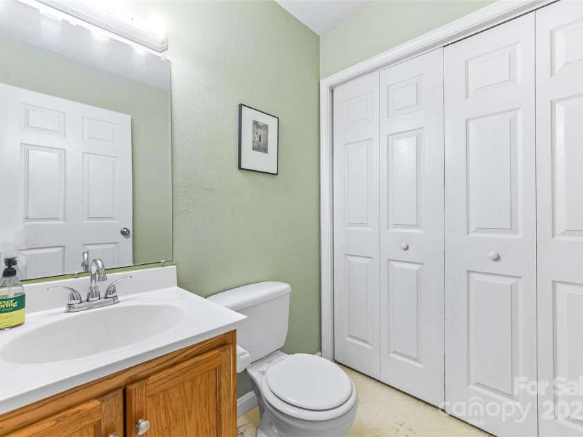 153 Hudson Street, Asheville, NC 28806.  MLS# CAR4288331, YatesRealty ID 32575. Half bath on main level with laundry.