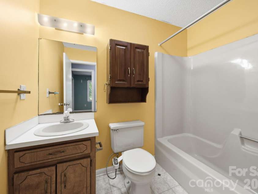11488 Beagle Street, Midland, NC 28107.  MLS# CAR4397037, YatesRealty ID 32579. Guest Bathroom.