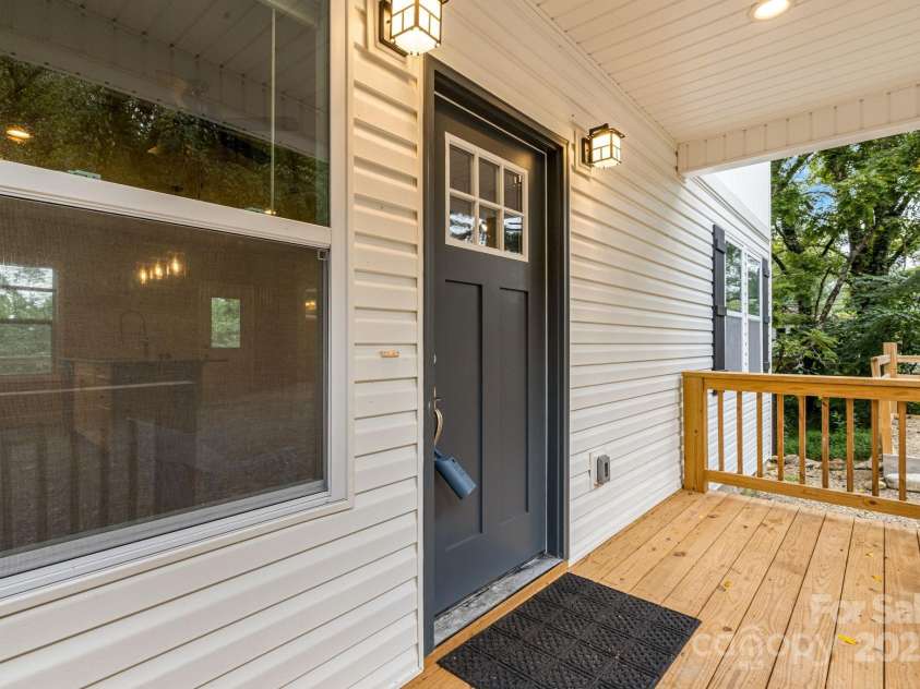 92 Moody Avenue, Candler, NC 28715.  MLS# CAR4291918, YatesRealty ID 32579. Covered front porch
