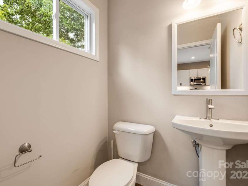 92 Moody Avenue, Candler, NC 28715.  MLS# CAR4291918, YatesRealty ID 32579. Downstairs half bath