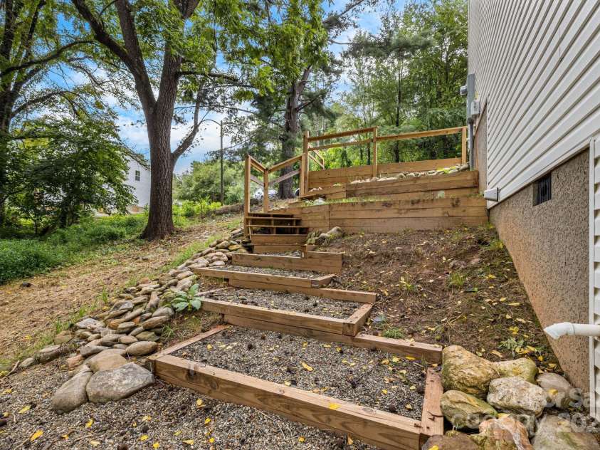 92 Moody Avenue, Candler, NC 28715.  MLS# CAR4291918, YatesRealty ID 32579. Side Yard Steps