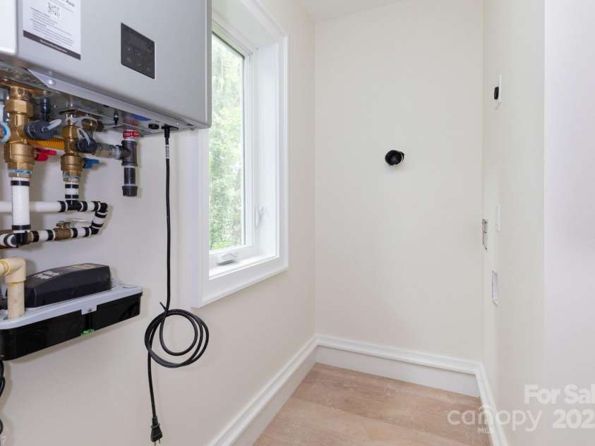 32 Waynesville Avenue, Asheville, NC 28806.  MLS# CAR4288925, YatesRealty ID 32595. Gas Water Heater and Stackable Washer Dryer