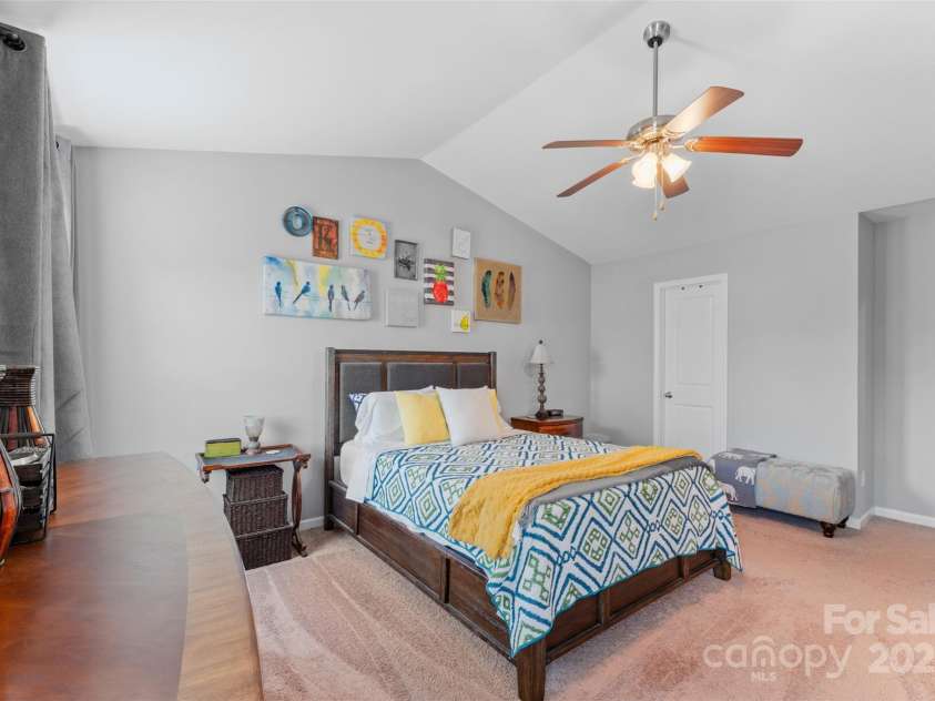 4711 William Caldwell Avenue, Charlotte, NC 28213.  MLS# CAR4289224, YatesRealty ID 32598. Primary Bedroom with vaulted ceilings & ceiling fan