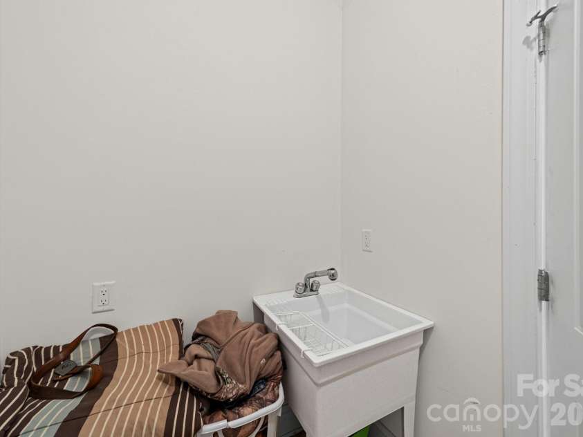 10962 Busbin Road, Mount Pleasant, NC 28124.  MLS# CAR4352597, YatesRealty ID 3260. Laundry room with wash sink.