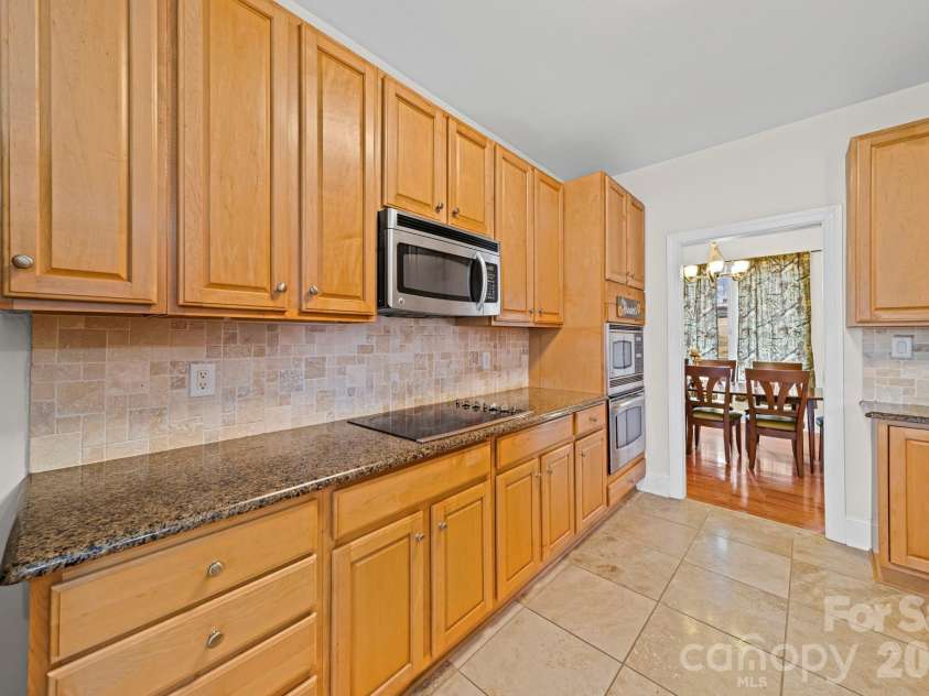 10962 Busbin Road, Mount Pleasant, NC 28124.  MLS# CAR4352597, YatesRealty ID 3260. Plenty of cabinets and countertop space in this adequate kitchen.