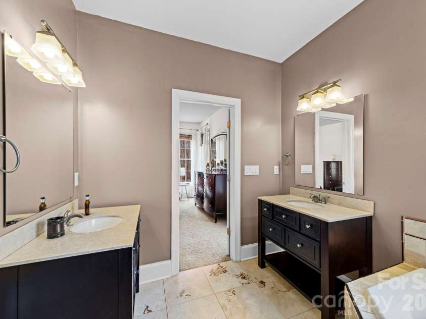 10962 Busbin Road, Mount Pleasant, NC 28124.  MLS# CAR4352597, YatesRealty ID 3260. Primary bath with separate vanities.