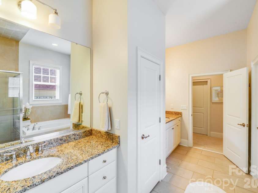 2702 Arsdale Road, Waxhaw, NC 28173.  MLS# CAR4287994, YatesRealty ID 32615. This final view of the primary en-suite bath emphasizes its functionality and spacious dual-vanity layout.