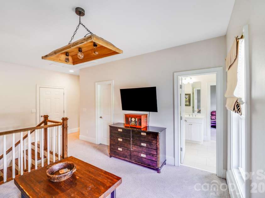 2702 Arsdale Road, Waxhaw, NC 28173.  MLS# CAR4287994, YatesRealty ID 32615. This final view of the second-floor loft highlights its practical layout and proximity to secondary bedrooms and a full bath