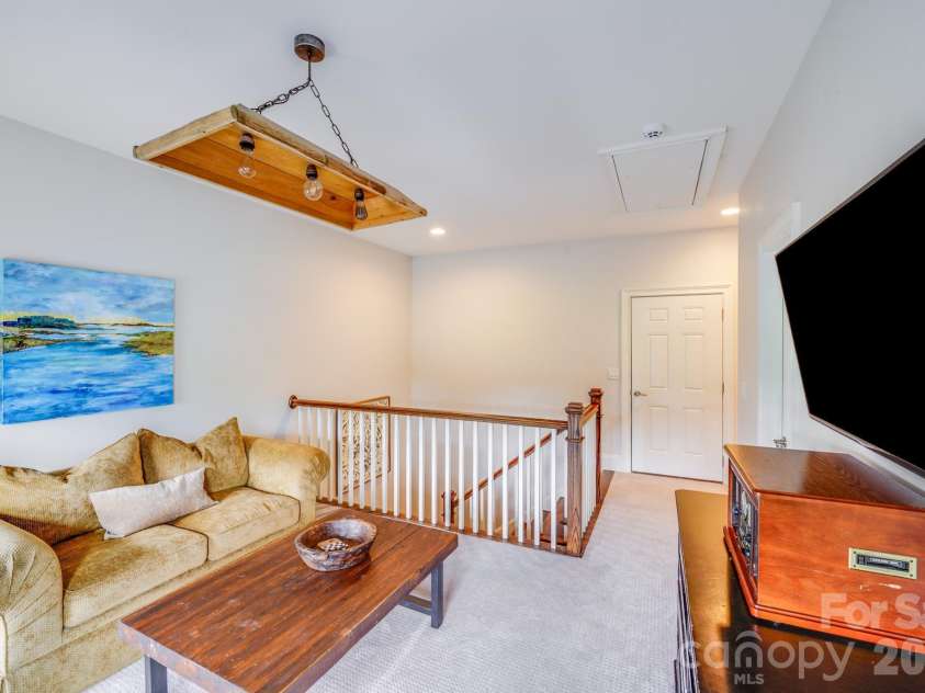 2702 Arsdale Road, Waxhaw, NC 28173.  MLS# CAR4287994, YatesRealty ID 32615. This second view of the loft highlights it's ample room for seating, study, or play, making it a great option for a teen hangout, home office, or secondary living area