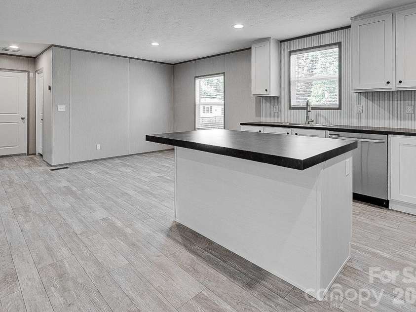 1848 Brittany Trail, Pleasant Garden, NC 27313.  MLS# CAR4394357, YatesRealty ID 32616. Kitchen with eat at bar
