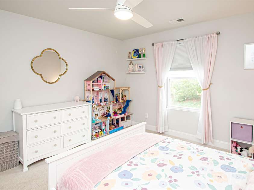 1061 Ansley Park Drive, Fort Mill, SC 29707.  MLS# CAR4281028, YatesRealty ID 32626. Bedroom 2 is generously sized and features a ceiling fan with light kit and a spacious walk-in closet.