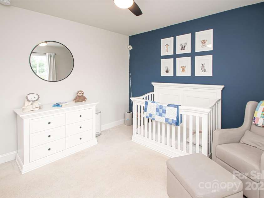 1061 Ansley Park Drive, Fort Mill, SC 29707.  MLS# CAR4281028, YatesRealty ID 32626. Bedroom 3 is also generously sized, offering a ceiling fan with light kit and a large walk-in closet for ample storage.