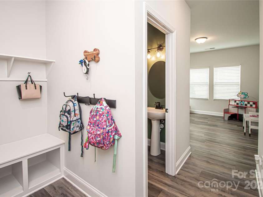 1061 Ansley Park Drive, Fort Mill, SC 29707.  MLS# CAR4281028, YatesRealty ID 32626. The drop zone, conveniently located next to the garage, is perfect for organizing backpacks, shoes, and everyday essentials.