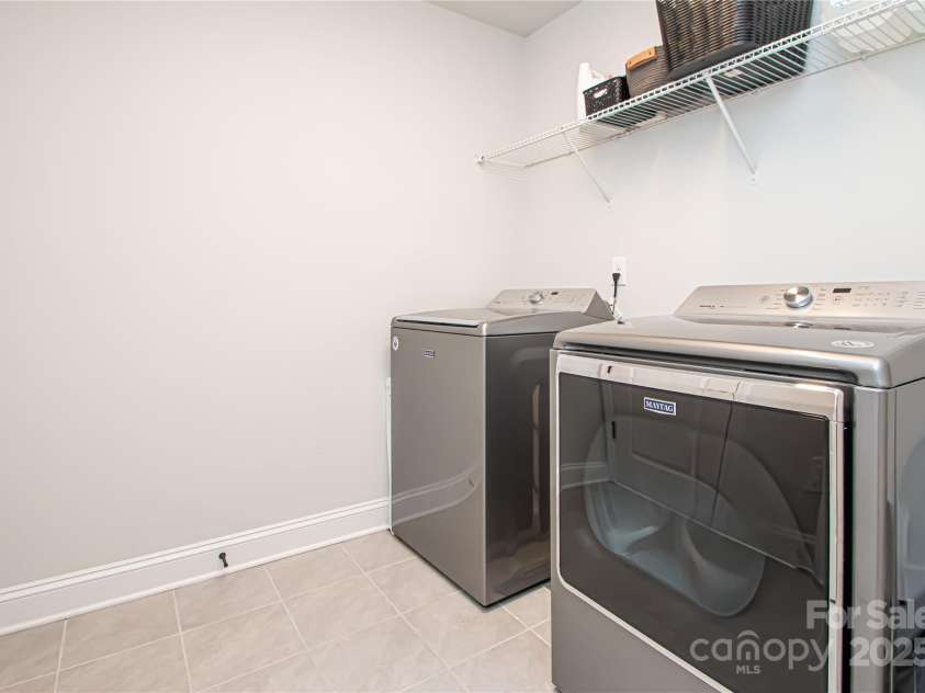 1061 Ansley Park Drive, Fort Mill, SC 29707.  MLS# CAR4281028, YatesRealty ID 32626. The laundry room is conveniently located on the second floor, just steps from the bedrooms for added ease and efficiency.