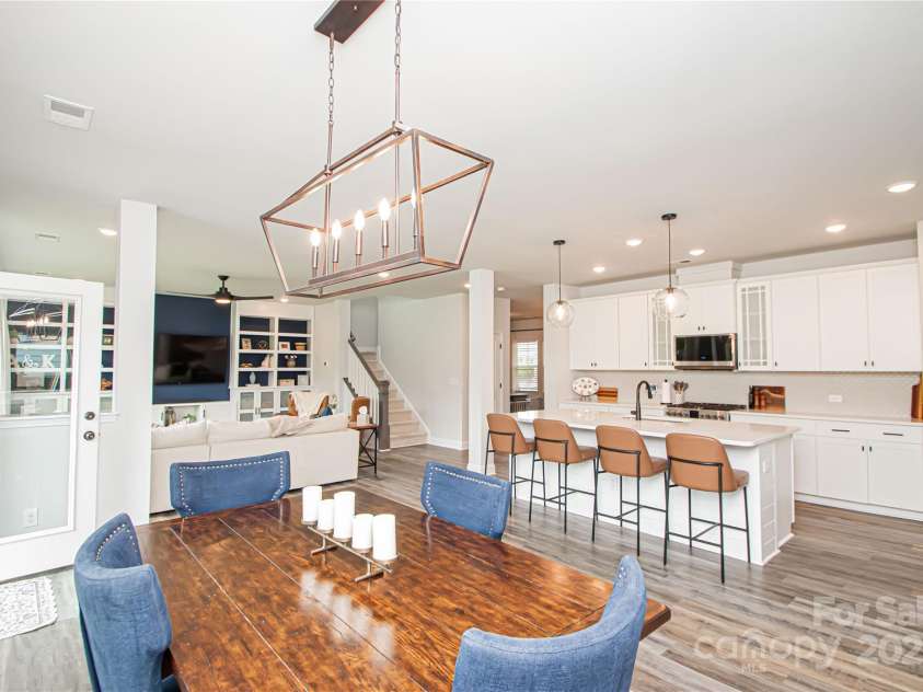 1061 Ansley Park Drive, Fort Mill, SC 29707.  MLS# CAR4281028, YatesRealty ID 32626. The open floor plan seamlessly connects the kitchen, dining area, and family room—ideal for everyday living and entertaining.