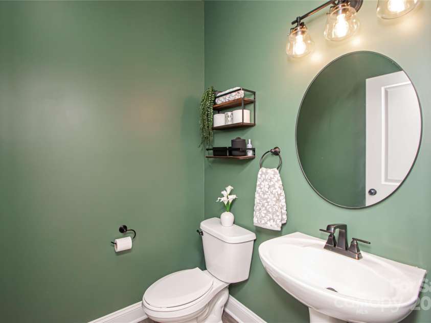 1061 Ansley Park Drive, Fort Mill, SC 29707.  MLS# CAR4281028, YatesRealty ID 32626. The powder room is conveniently located near the flex room, offering easy access for guests.