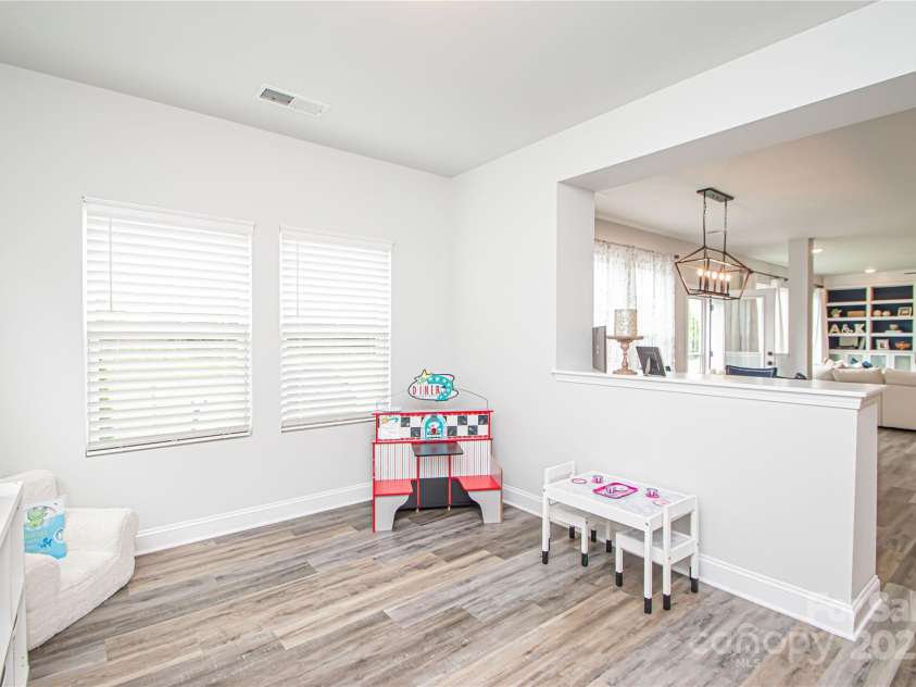 1061 Ansley Park Drive, Fort Mill, SC 29707.  MLS# CAR4281028, YatesRealty ID 32626. The versatile flex room can be used as a playroom, home gym, yoga space, additional sitting area, or even a second office—tailored to fit your lifestyle.