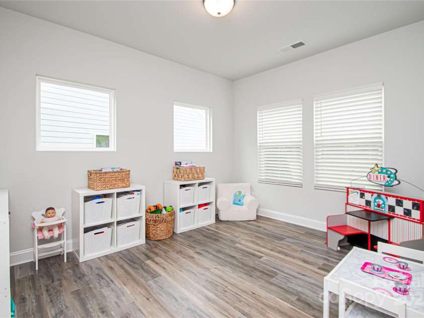 1061 Ansley Park Drive, Fort Mill, SC 29707.  MLS# CAR4281028, YatesRealty ID 32626. The versatile flex room can be used as a playroom, home gym, yoga space, additional sitting area, or even a second office—tailored to fit your lifestyle.