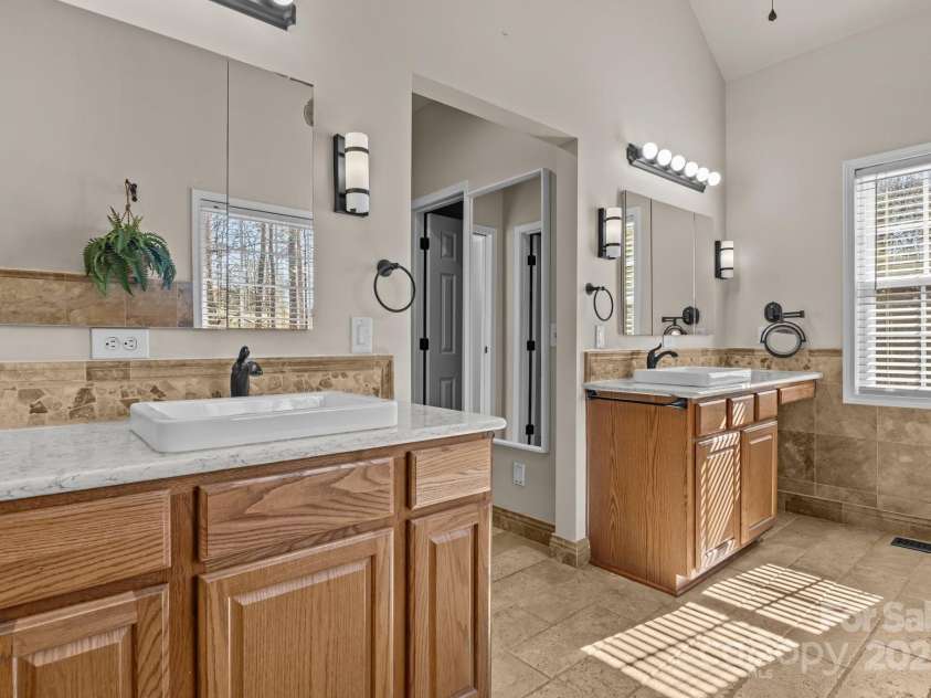 10179 Claybrooke Drive, Charlotte, NC 28262.  MLS# CAR4281474, YatesRealty ID 32627. Another view of the primary bathroom