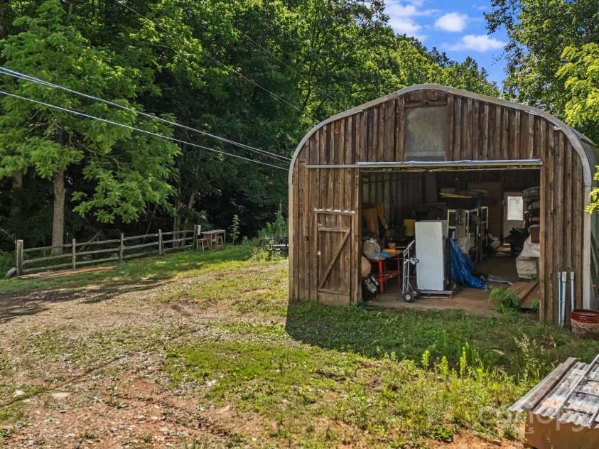 799 Fire Scald Road, Green Mountain, NC 28740.  MLS# CAR4226688, YatesRealty ID 32632. Quonset hut