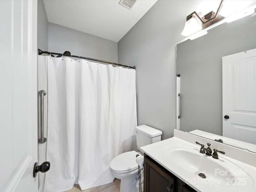1402 Wynhurst Drive, Waxhaw, NC 28173.  MLS# CAR4290603, YatesRealty ID 32635. En suite bathroom for mother in law suite.